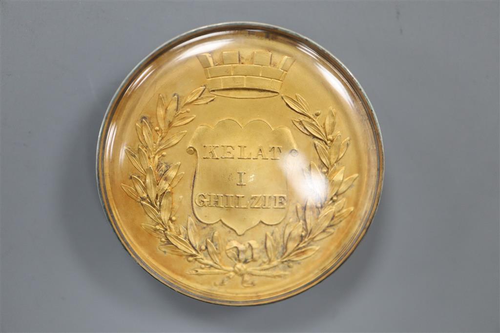 A medal for the Defense of Kelat-I-Ghilzie; gilt and glass cased